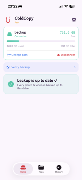 Home screen showing backup is up to date with green checkmark